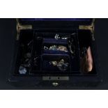 A jewellery box with costume jewellery, continental hat pins, earrings,