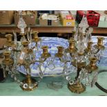 A pair of six branch gilt metal table candelabra with glass droplets
