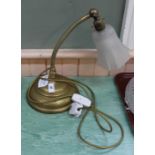 A brass adjustable table lamp (this item is sold as a collectors item only and has not been subject