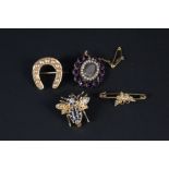 A mixed lot of brooches including yellow metal horseshoe shape set with split pearls (some missing),