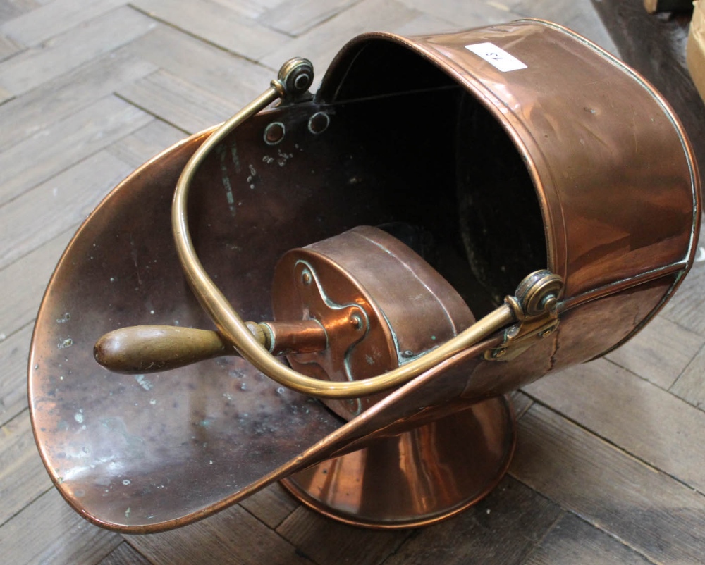 A 19th Century copper coal helmet and scoop