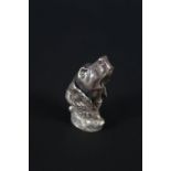 A silver dogs head vesta