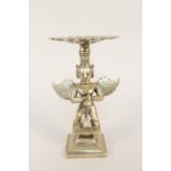 An Indian brass figure of a standing winged deity with head dress,