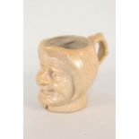 A 19th Century English salt glaze stoneware mask jug