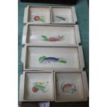 A Susie Cooper hors d'oeuvres set with vegetable painting (one piece chipped)