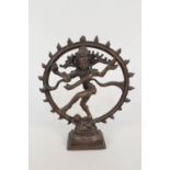 An Indian bronze of Kali standing on a prostrate child,