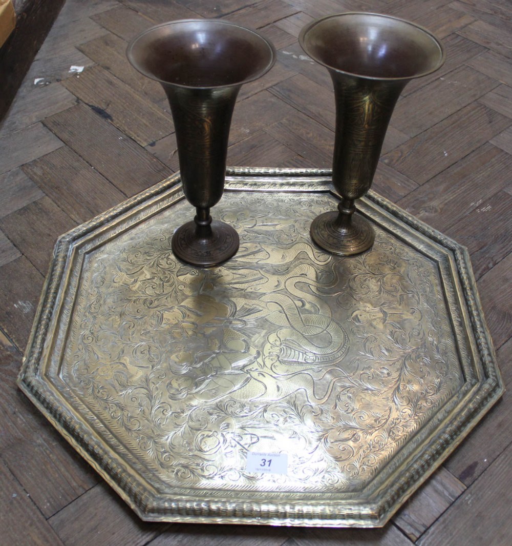 An Indian brass tray with snake charming decoration plus a pair of brass vases