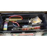 A Curver box containing reels, floats and tackle including Penn, Ocean City, Shimano,