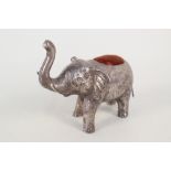 A white metal elephant pin cushion, length 5",