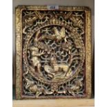 A Chinese carved giltwood and red lacquer panel with dragon and floral decoration,