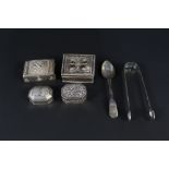 Four eastern white metal snuff/pill boxes, one with filigree decoration,