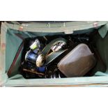 An Efgeeko box containing a quantity of reels and floats including Daiwa, Penn, Shakespeare,