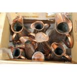 Nine copper jugs with reptile skin decorated effect