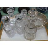Four decanters plus a cut glass silver rim bowl