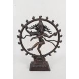 An Indian bronze of Kali standing on a prostrate child,