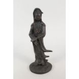 A Chinese bronze of Kwan Yin with red coral decoration,