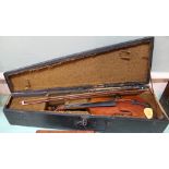 A cased violin and bow,