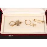 A mixed jewellery lot consisting of an 18ct gold bar brooch, an ornate yellow metal cross pendant,