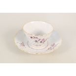 A Flight & Barr Worcester fluted tea bowl and saucer with mauve and gilt floral decoration