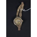 A lady's 18ct gold wristwatch on 9ct gold mesh strap
