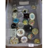A box of various paperweights