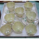 Eight Belleek Shamrock cups and saucers