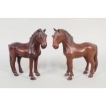 A pair of carved hardwood horses