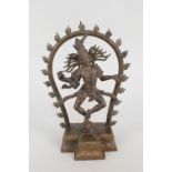 An Indian bronze of Kali standing on a prostrate child,