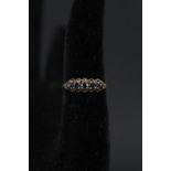 A 9ct gold ring set with sapphires,