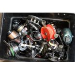 A box containing a large quantity of reels including Mitchell, Daiwa, Winfield, Abu,