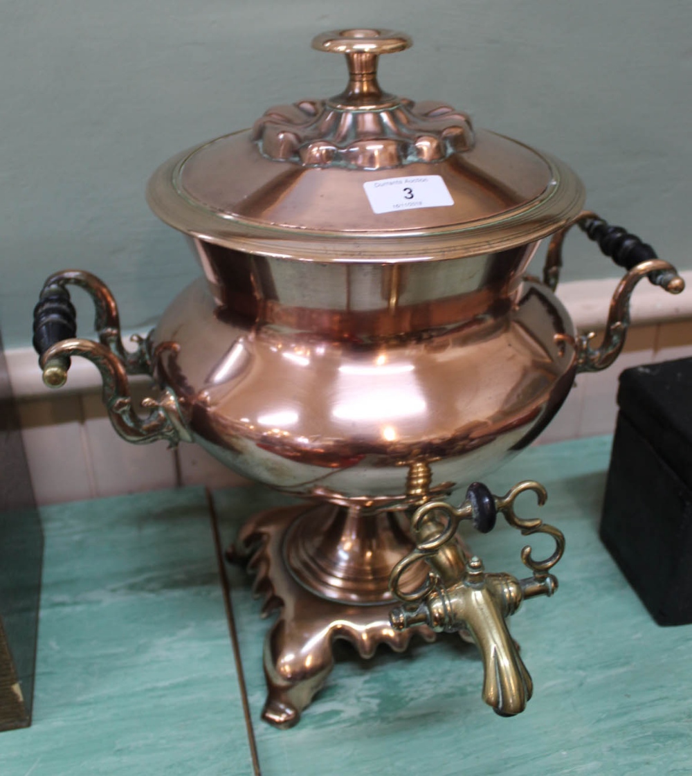 A Regency twin handled copper samovar with baluster body, brass tap,