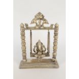 An Indian bronze of Ganesh on a swing,