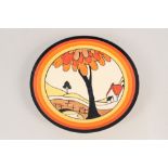 A Clarice Cliff house and bridge plate