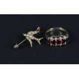 A 9ct gold ring set with garnets and paste stones plus a yellow metal seed pearl set brooch in the
