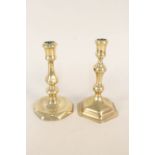 Two 18th Century brass candlesticks on octagonal bases