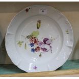 A 19th Century German porcelain dished plated with relief moulded rim sections and floral painting,