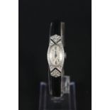 A lady's platinum cased Art Deco wristwatch set with sapphires and diamonds (one stone missing) on