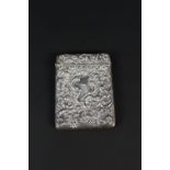 A silver card case with floral embossed decoration, vacant cartouche to both sides, Birmingham 1903,