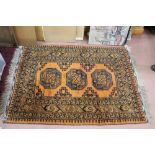 An Afghan rug with three central medallions,