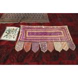 An Indian silk and mirrored shaped hanging plus a woolwork floral cover