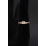 An 18ct gold ring set with a single diamond,