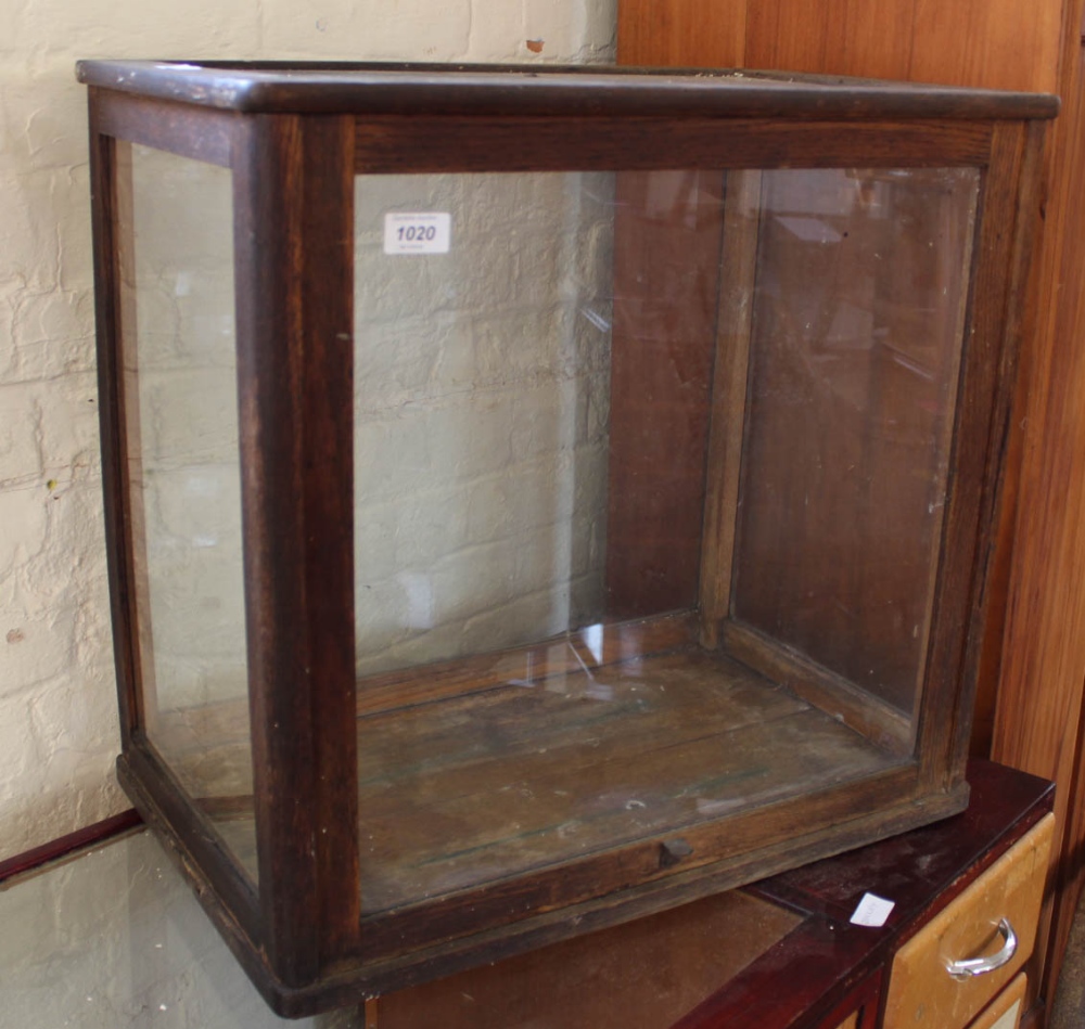 An oak glazed table top display case
