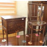 A 1920's oak workbox and contents on stand,