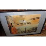 A framed and glazed print of film poster for 'Skyscraper'