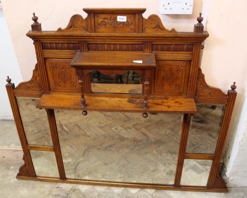 An Edwardian oak overmantel mirror