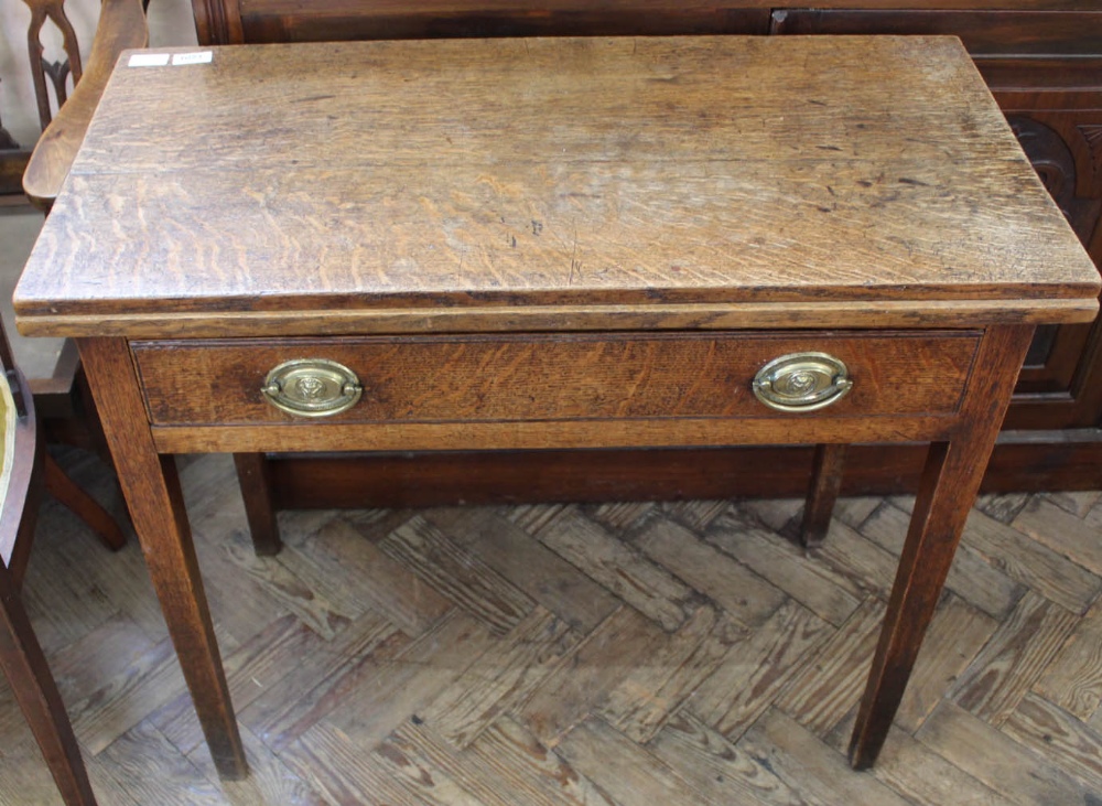 A 19th Century oak tea table with single drawer and original handles