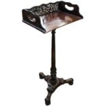 A 19th Century carved rosewood bookstand with pierced and galleried upstand