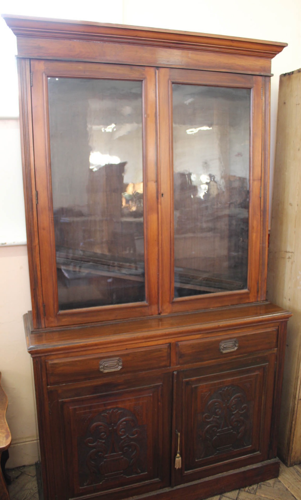 An Edwardian American walnut two drawer,