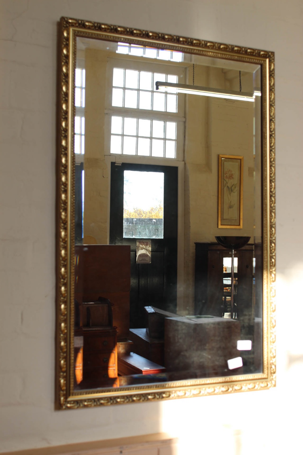 A rectangular gilt frame mirror