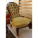 A Victorian mahogany balloon back nursing chair with gold button back upholstery